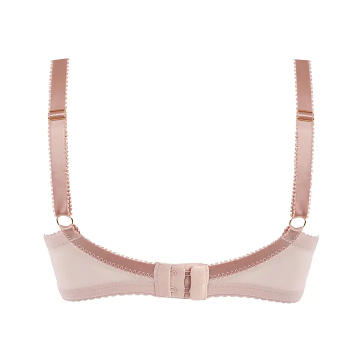 Postaw na model, który łączy zmysłową elegancję z doskonałą konstrukcją. Mediolano Jasmin w wersji semi soft to biustonosz stworzony dla kobiet, które oczekują zarówno efektu modelowania, jak i wygody.
Dolna część miseczki jest delikatnie usztywniona, dzięki czemu stabilnie zbiera i unosi biust, nadając mu naturalnie zaokrąglony kształt. Górna część wykonana z subtelnej koronki i transparentnej siateczki idealnie dopasowuje się do piersi, zapewniając lekkość i elegancki wygląd.
Koronkowe wykończenie w modnym, pudrowym odcieniu podkreśla romantyczny charakter modelu, a ozdobny detal przy mostku dodaje mu luksusowego akcentu.
Dlaczego warto wybrać Jasmin Semi Soft? ✔ półusztywniana konstrukcja – idealne podtrzymanie ✔ naturalne modelowanie i zebranie biustu ✔ komfort noszenia przez cały dzień ✔ elegancka, kwiatowa koronka ✔ idealny do codziennych stylizacji i pod dopasowane ubrania
To bielizna, która nie tylko wygląda pięknie, ale przede wszystkim pracuje dla Twojej sylwetki.
85% Poliamid, 10% Elastan, 5% Poliester